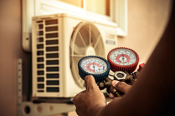 Professional Air Conditioning Service technician working in Glenwood, WV